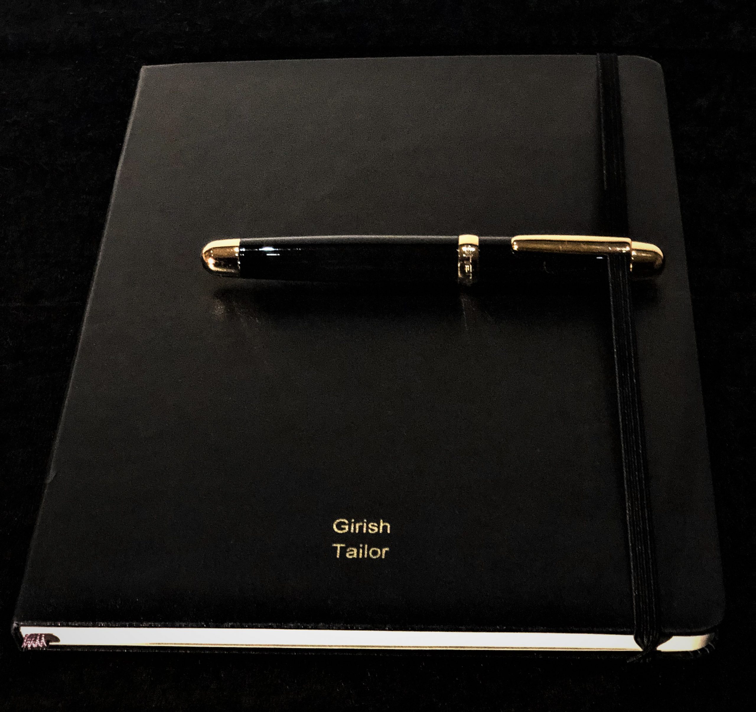 Bespoke and personalised black Moleskine notebook or journal, with an elegant and luxury black and gold pen