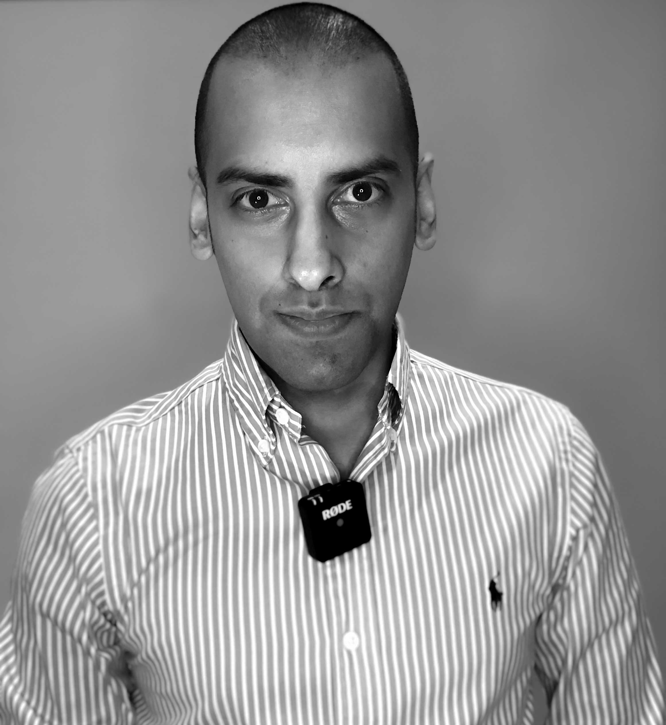 Ready to be interviewed wearing a Ralph Lauren striped shirt and Rode Wireless Go microphone