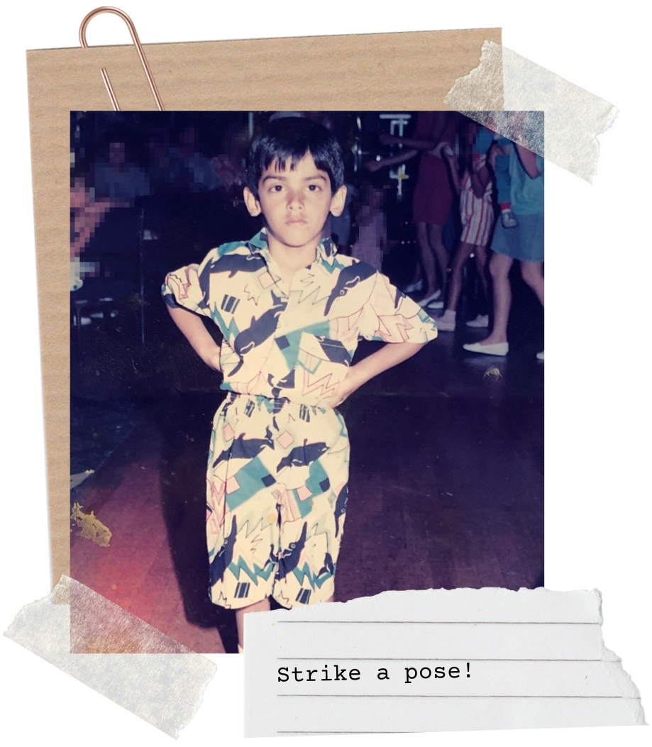 Child posing as if on the catwalk - dressed in a stylish, flamboyant and bold childrenswear outfit